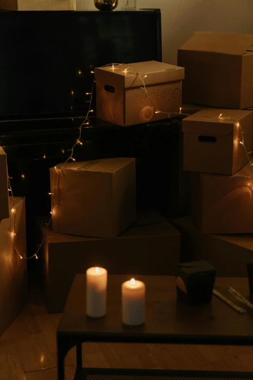 a living room filled with boxes and candles, light and space, light show