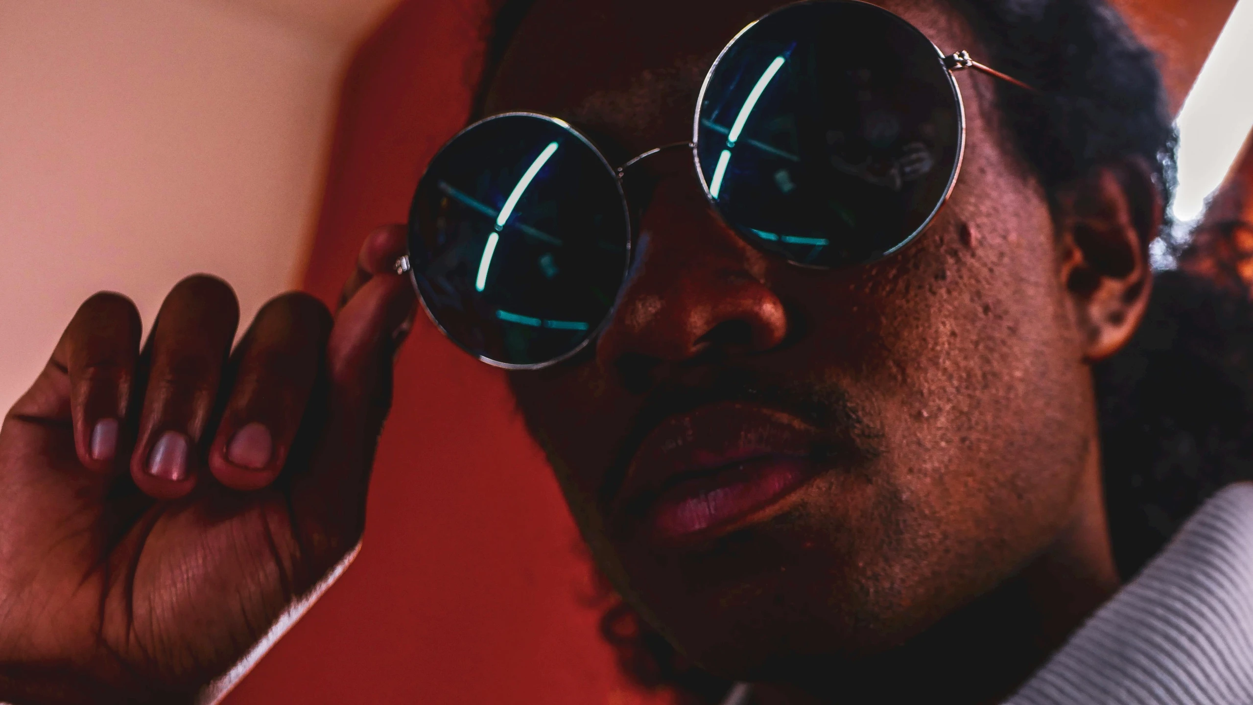a close up of a person wearing sunglasses, trending on pexels, childish gambino, neon noir, redshift vibes, reflecting