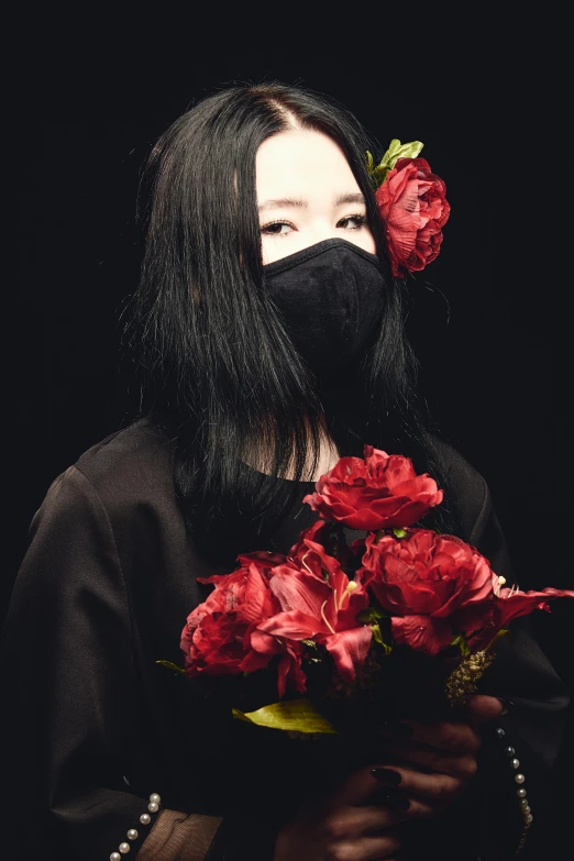a woman wearing a face mask holding a bunch of flowers, an album cover, inspired by Ayako Rokkaku, unsplash, techwear occultist, takato yomamoto, dark. no text, fabric