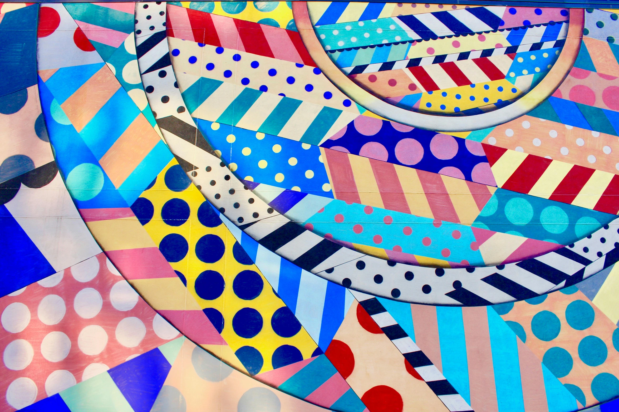 a close up of a colorful piece of art, a pop art painting, inspired by Frank Stella, trending on pexels, dazzle camouflage!, circles, where's wally, quilt