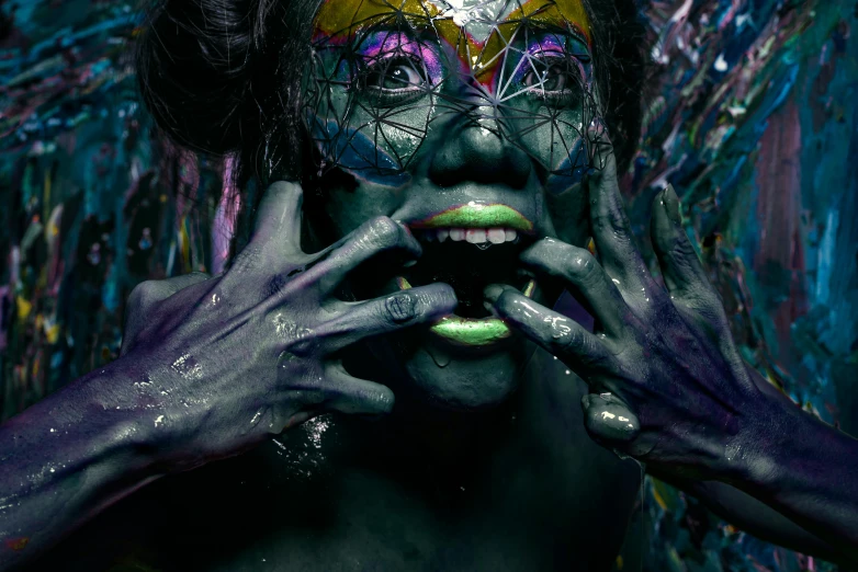 a close up of a person with paint on their face, an album cover, inspired by Alberto Seveso, pexels contest winner, dark goddess with six arms, “uwu the prismatic person, cyberpunk horror style, acid graphix
