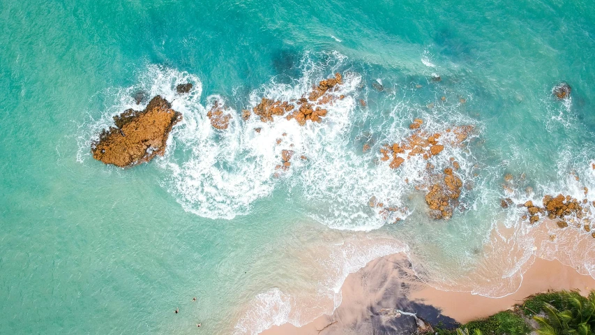 a view of the ocean from a bird's eye view, pexels contest winner, australian beach, waves crashing at rocks, thumbnail, tropical ocean