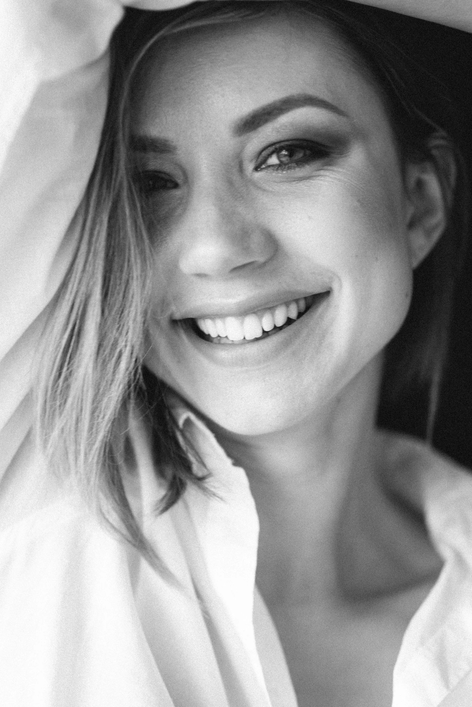 a black and white photo of a woman smiling, tumblr, olya bossak, white clothes, close-up!!!!!!, sydney sweeney