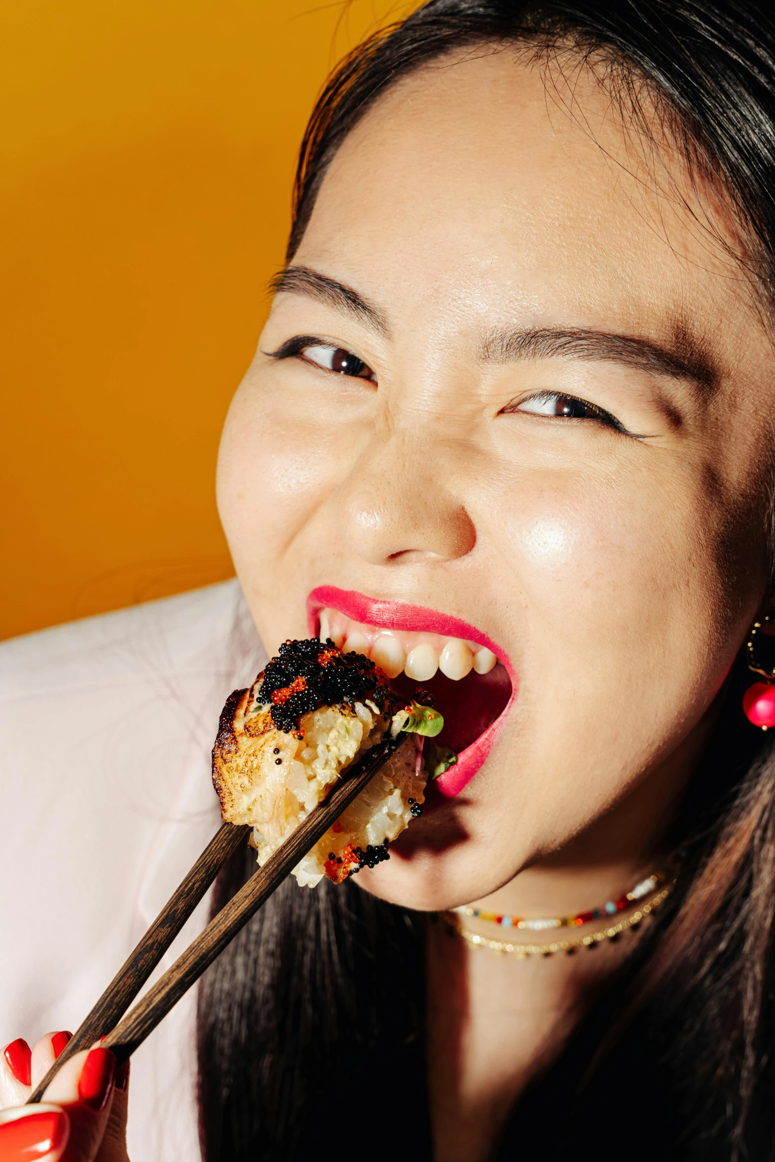 a woman eating sushi with chopsticks in her mouth, an album cover, by Julia Pishtar, trending on pexels, mingei, demna gvasalia, portrait n - 9, joy ang, black