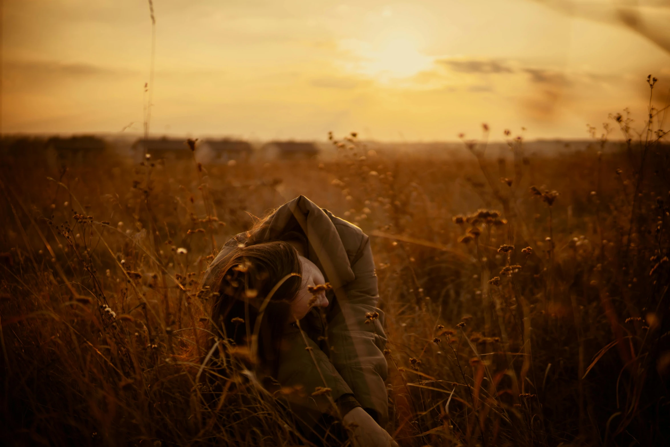 a person laying in a field of tall grass, pexels contest winner, conceptual art, sunset golden hour hues, cloak covering face, brown, photos