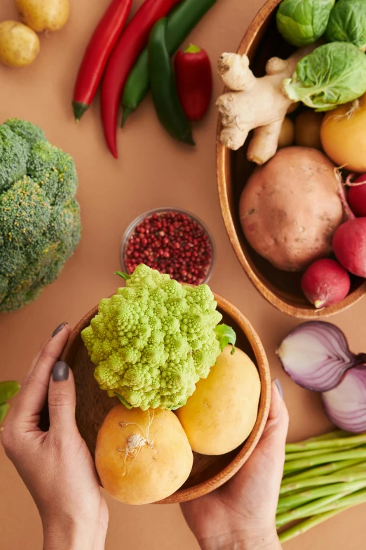 a person holding a bowl of vegetables on a table, curated collection, uncrop, cardboard, promotional image