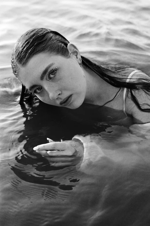 a black and white photo of a woman in the water, inspired by Max Dupain, unsplash, photorealism, portrait of florence pugh, natalia dyer, bruce weber, madison beer