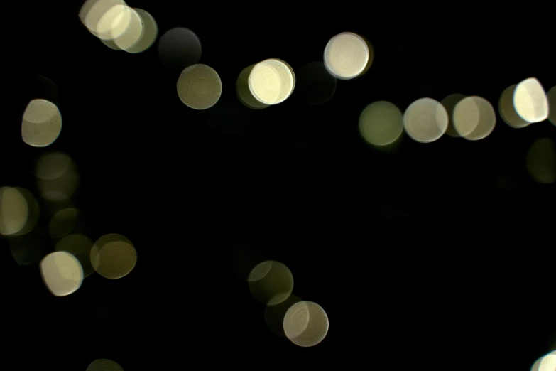 a bunch of lights that are in the dark, a picture, unsplash, light and space, low quality footage, 70mm film screenshot, floating pieces, greenish lighting