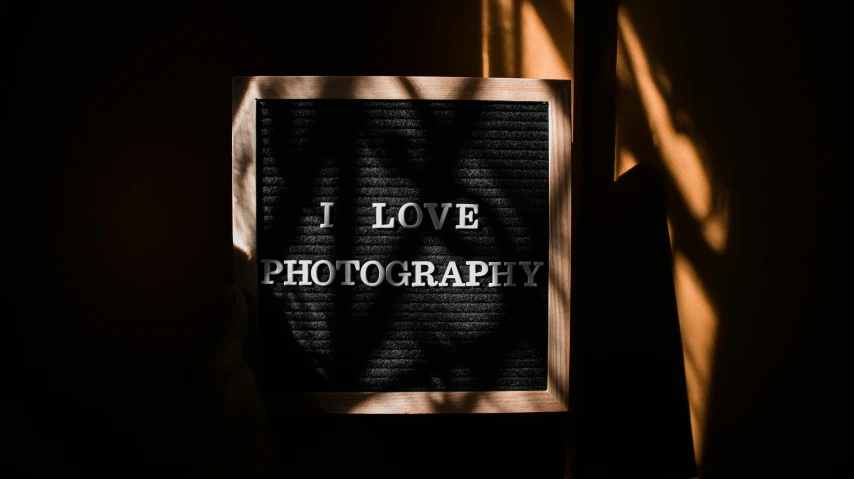 a sign that says i love photography next to a window, by Julia Pishtar, art photography, 1800 photograph, professional image, medium format. soft light, on a canva