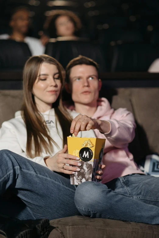 a couple of people that are sitting on a couch, a picture, sitting in a movie theater, jovana rikalo, advertising photo, mrbeast