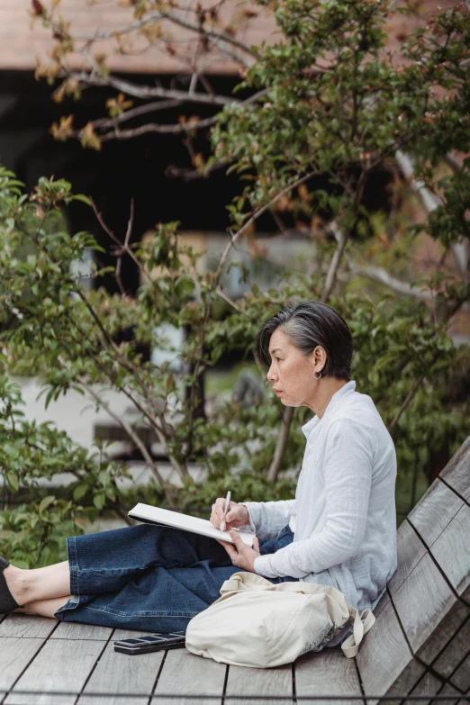 a woman sitting on the ground reading a book, a portrait, inspired by Katsukawa Shunsen, unsplash, plein air, sit on a bench, dwell, kousuke oono, sitting on a tree