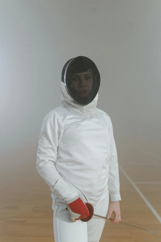 a man in a fencing suit standing on a court, staring at camera, in a space cadet outfit, balaclava, future inflatable jacket