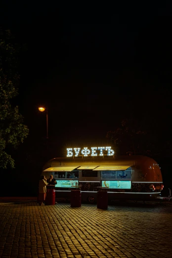a bus parked in a parking lot at night, by Sven Erixson, pexels contest winner, hyperrealism, lovers eat, sovietwave, bright signage, фото девушка курит