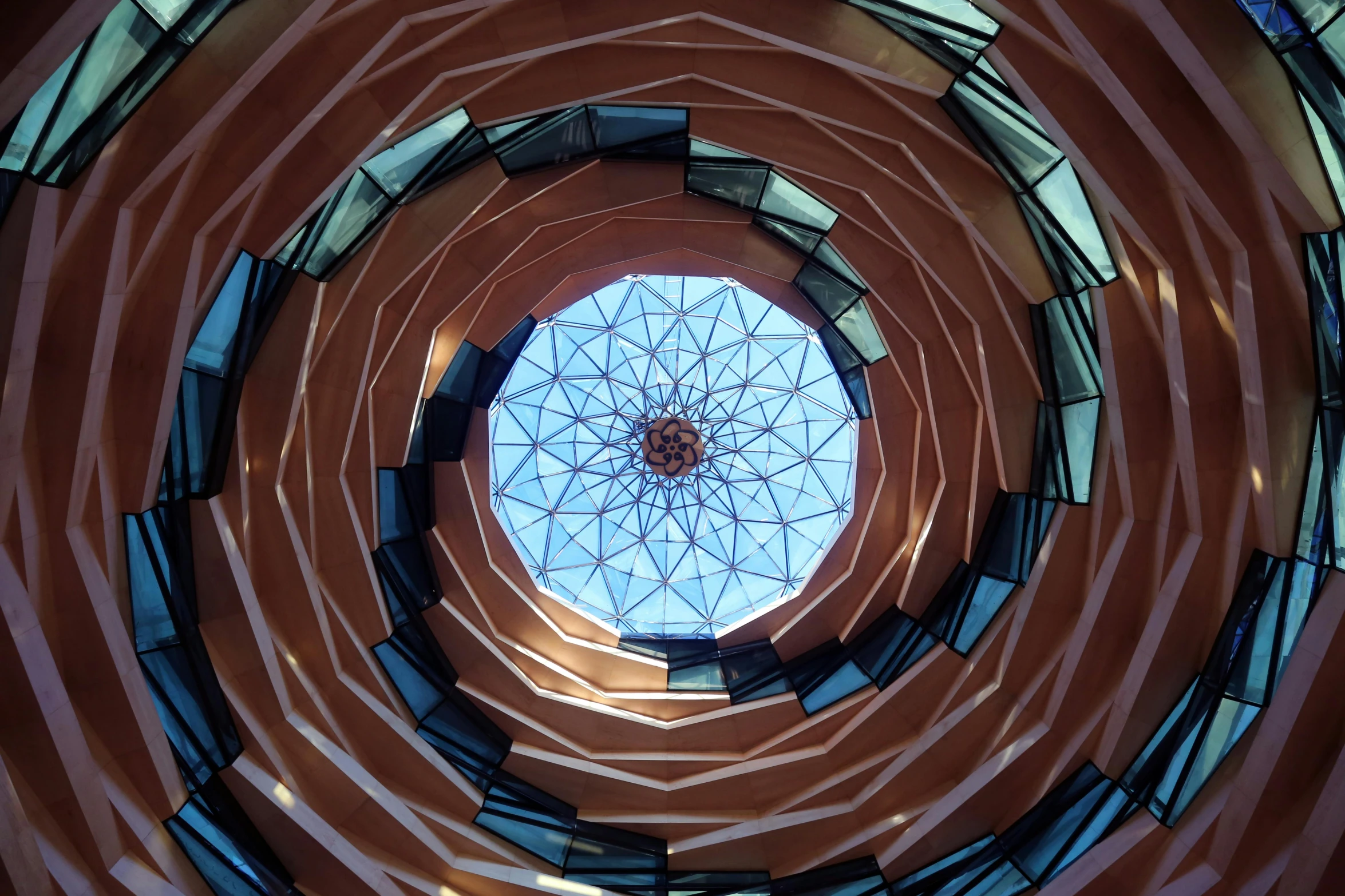 a picture of the inside of a building, inspired by Buckminster Fuller, unsplash contest winner, art nouveau, futuristic marrakech morocco, spiraling upward, high - angle view, looking up at camera