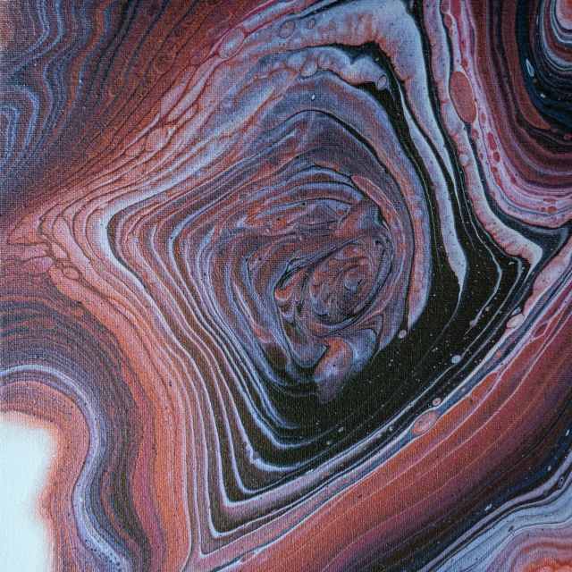 a close up of a piece of marble, an ultrafine detailed painting, by Jules Olitski, flickr, made of liquid purple metal, alternate album cover, brown red blue, oganic rippling spirals