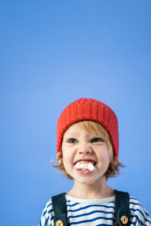 a little boy brushing his teeth with a toothbrush, by Doug Ohlson, wearing beanie, derp, getty images, marshmallow