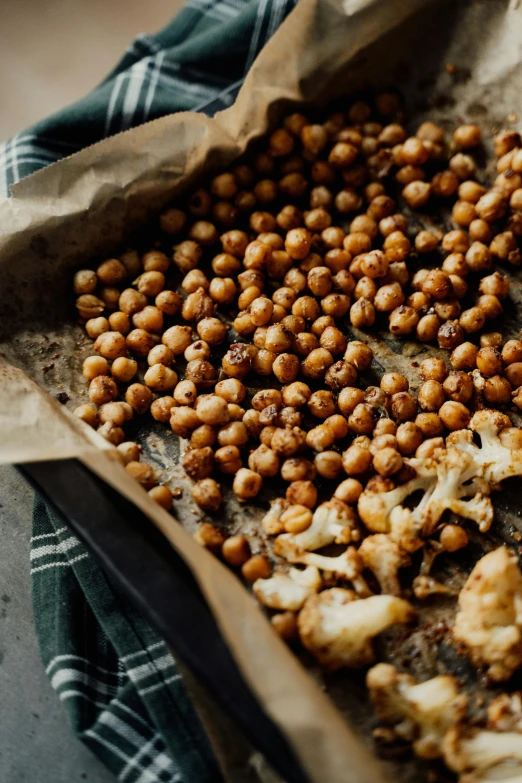 roasted chick and cauliflower on a baking sheet, unsplash, renaissance, polka dot, snacks, beans, very crispy