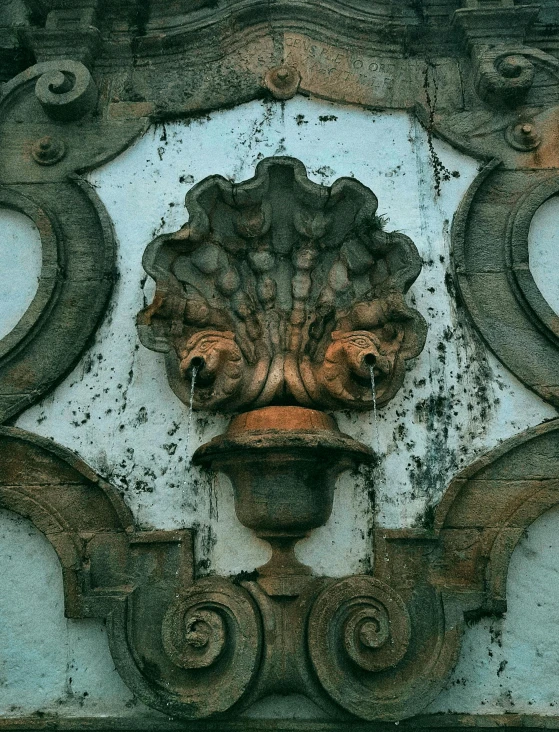 a clock mounted to the side of a building, an album cover, inspired by Luis Paret y Alcazar, trending on unsplash, renaissance, water fountain, sanjulian. detailed texture, pareidolia, architecture carved