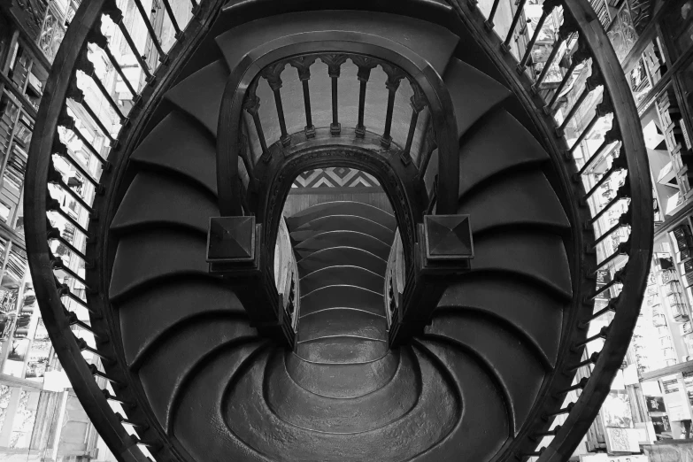 a black and white photo of a spiral staircase, a black and white photo, inspired by MC Escher, pexels contest winner, art nouveau, gothic style, andrei riabovitchev symmetrical, victorian gothic, 1 staircase