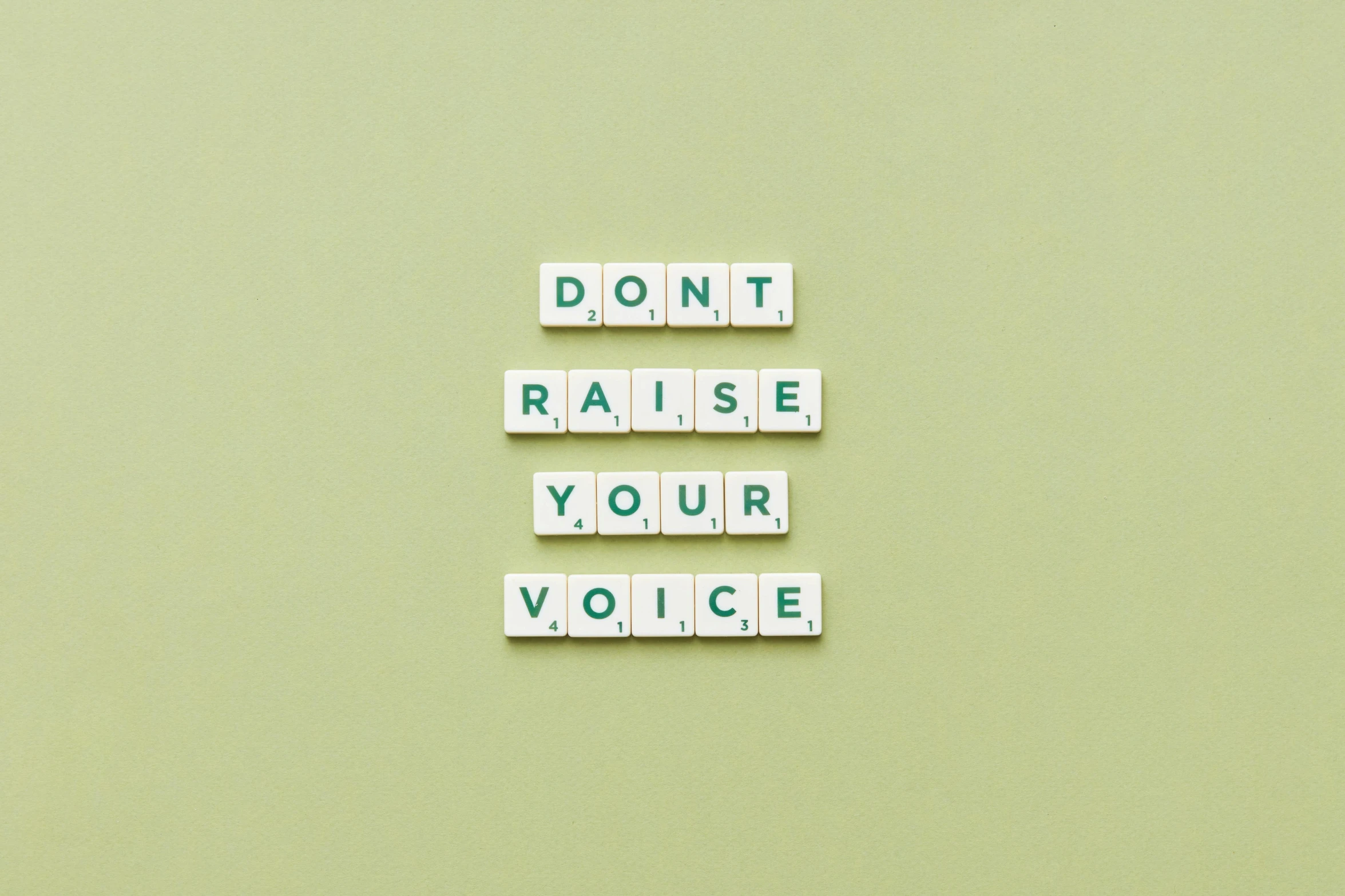 the words don't raise your voice spelled in scrabbles, trending on unsplash, renaissance, quotev, #green, nursing, vibration