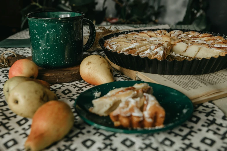 a pie sitting on top of a table next to a plate of fruit, by Emma Andijewska, pexels contest winner, green and warm theme, pear, 15081959 21121991 01012000 4k, table in front with a cup