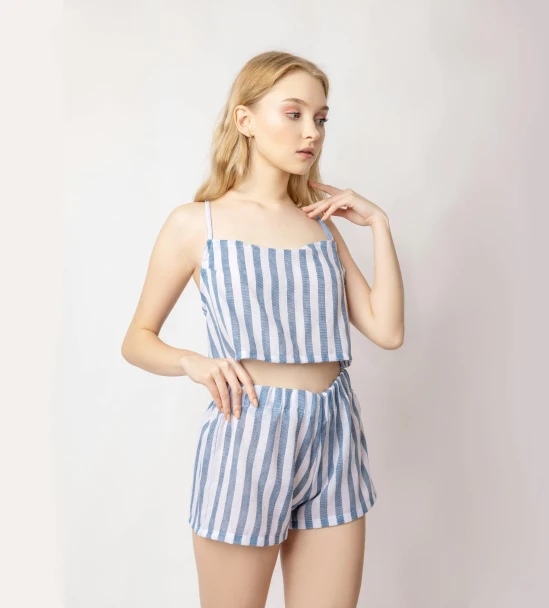 a woman wearing a blue and white striped top and shorts, dau-al-set, wearing a camisole, sansa, crop top, square