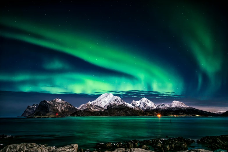 a large body of water with a mountain in the background, by Julia Pishtar, pexels contest winner, romanticism, northen lights background, national geographic ”, panels, threyda