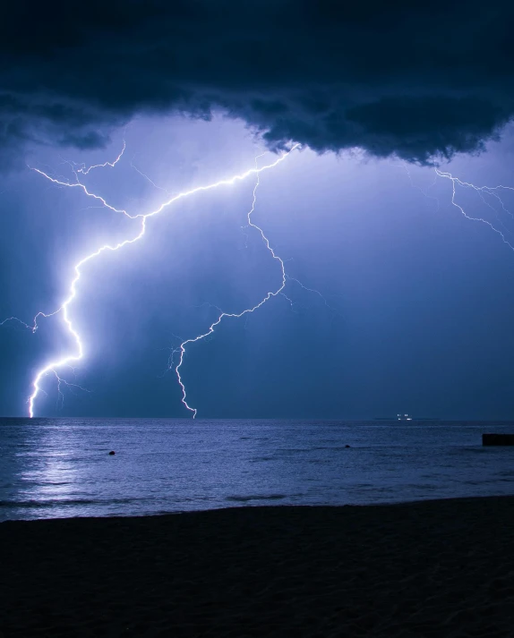 a lightning bolt in the sky over a body of water, by Jesper Knudsen, pexels contest winner, lgbtq, battered, epic scene of zeus, today\'s featured photograph 4k