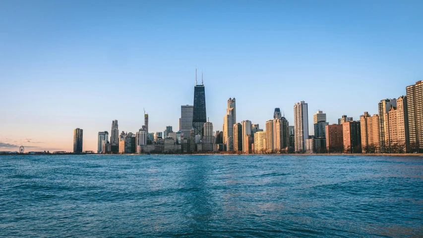 a view of the chicago skyline from the water, pexels contest winner, blue and clear sky, golden hour photo, 2 0 2 2 photo, mediterranean