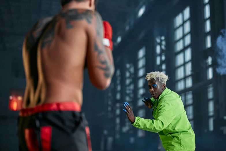 a man in a green jacket throwing a frisbee, pexels contest winner, wearing vibrant boxing gloves, young thug, behind the scenes photo, ( ( theatrical ) )