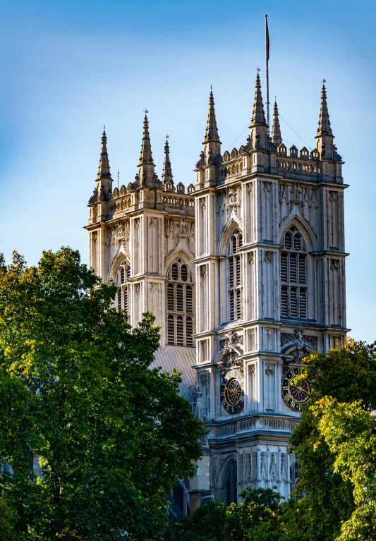 a large building surrounded by trees on a sunny day, by Edward Clark, shutterstock, baroque, alabaster gothic cathedral, square, underwater westminster, thumbnail