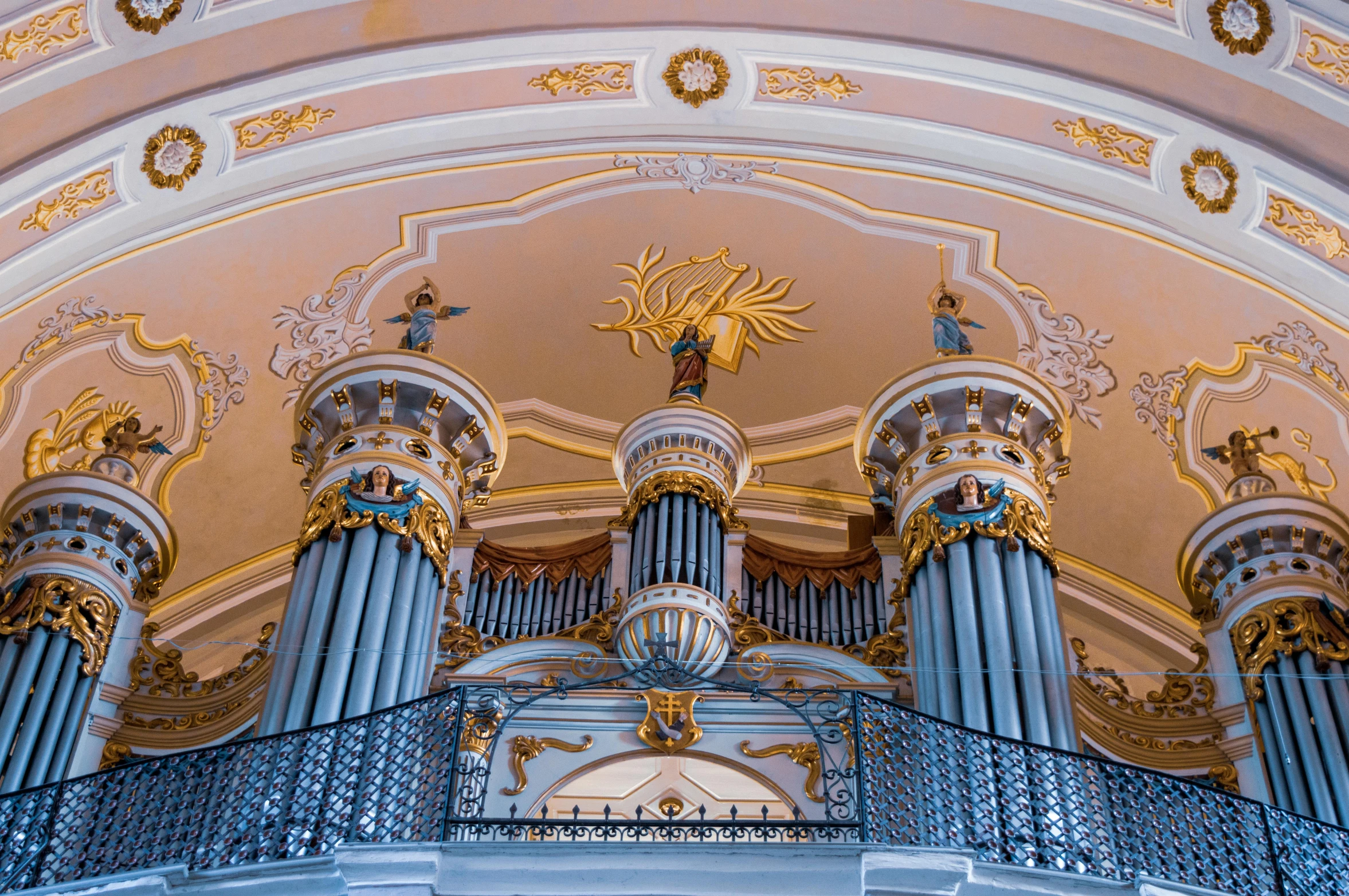 a large pipe organ sitting inside of a building, an album cover, pexels contest winner, baroque, blue and gold color scheme, saint petersburg, pillars on ceiling, profile image