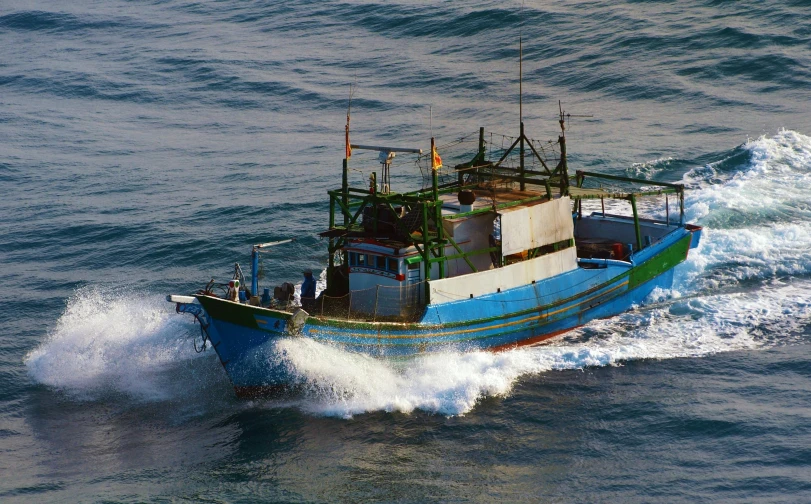 a blue and white boat in the middle of the ocean, hurufiyya, trading illegal goods, slide show, profile image