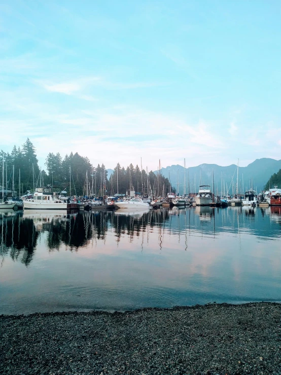 a body of water filled with lots of boats, a photo, pexels contest winner, vancouver school, 💋 💄 👠 👗, soft morning light, vhs colour photography, delightful surroundings