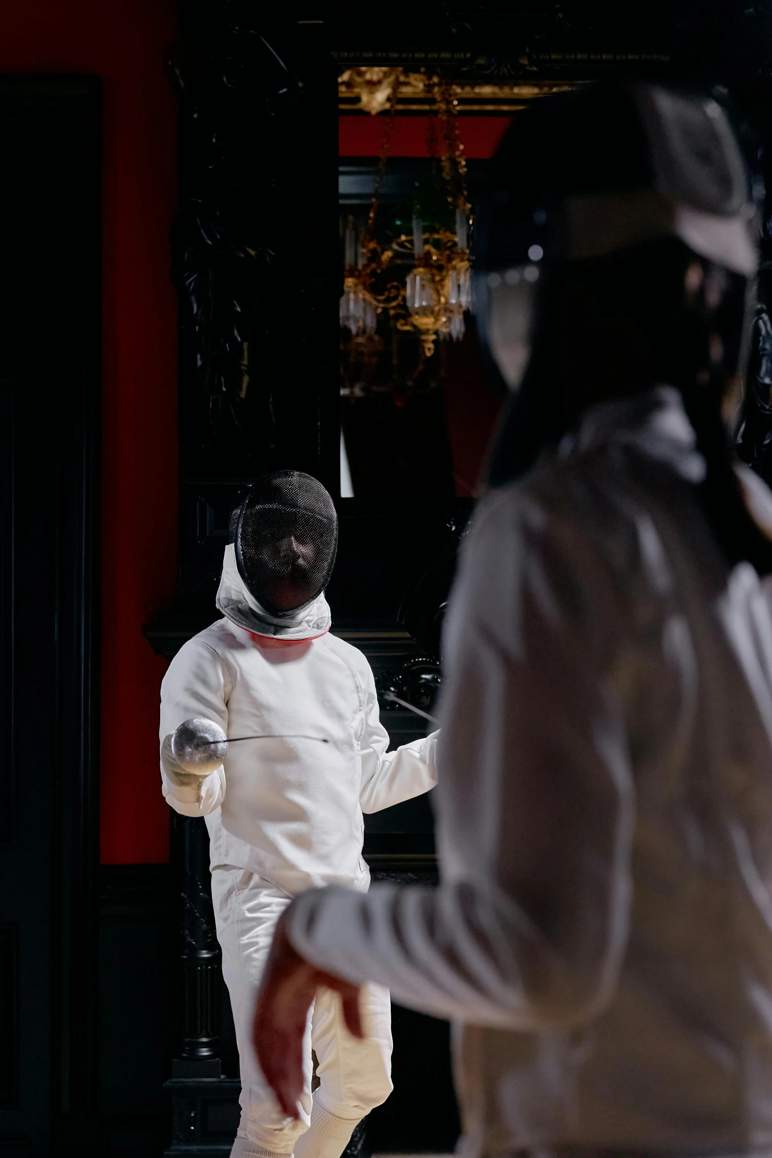 a couple of men standing next to each other on a court, inspired by Horace Vernet, happening, staff wearing hazmat suits, cinematic shot ar 9:16 -n 6 -g, slide show, fencing