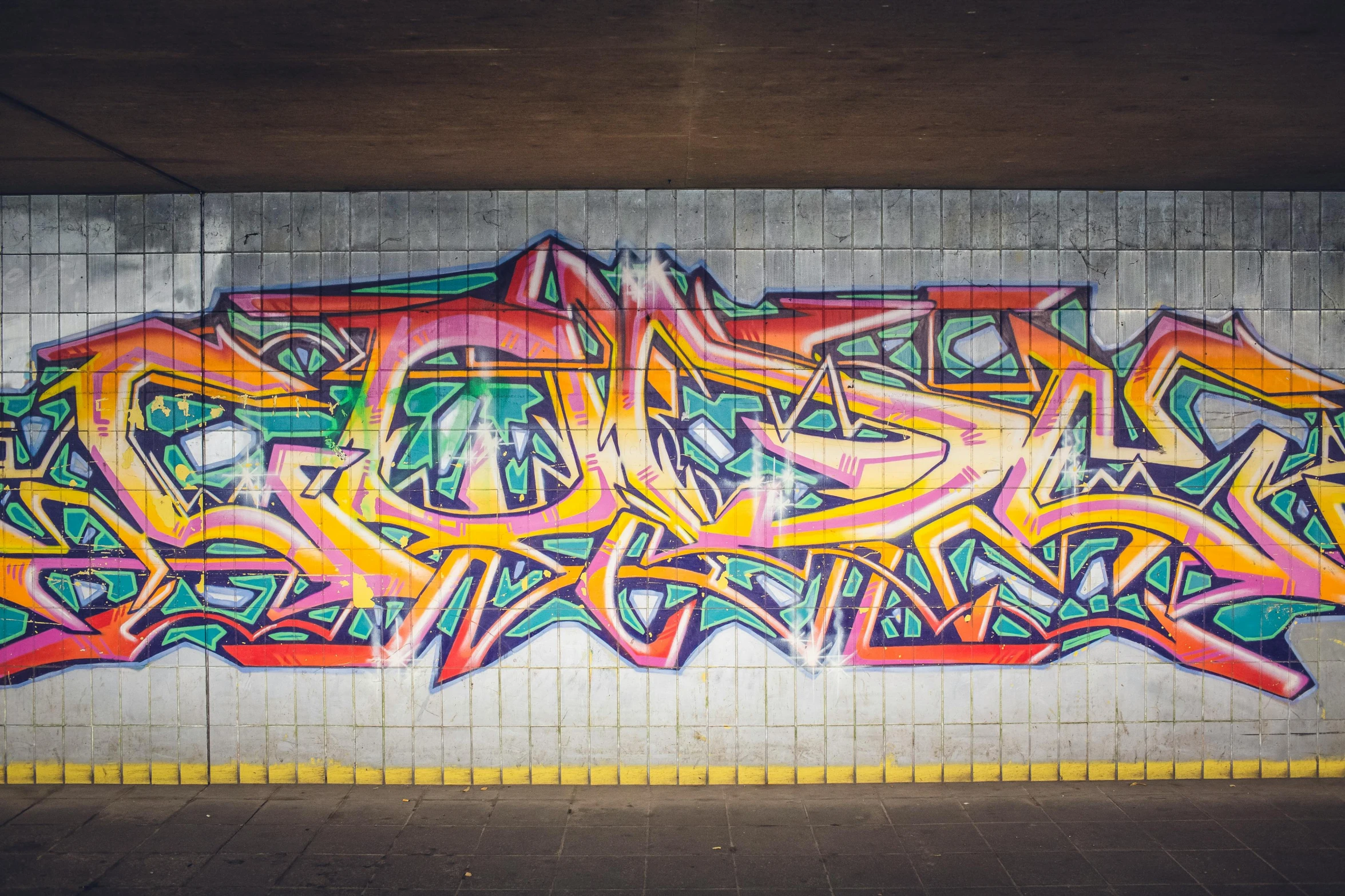 a wall that has some graffiti on it, graffiti art, by artist, pexels contest winner, graffiti, overpass, on the concrete ground, multicolored, chriss foss