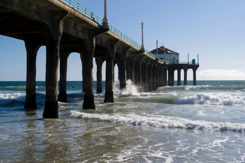 a pier that is next to the ocean, by Jacob Burck, unsplash contest winner, renaissance, los angeles, avatar image, on a sunny day, giant majestic archways