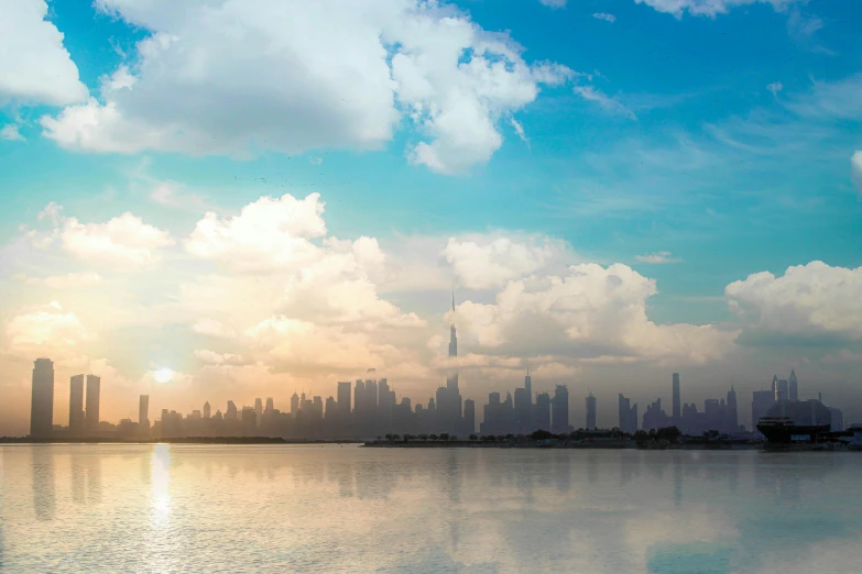 a large body of water with a city in the background, pexels contest winner, fine art, gta : dubai, glistening clouds in background, pastel sky, promo image