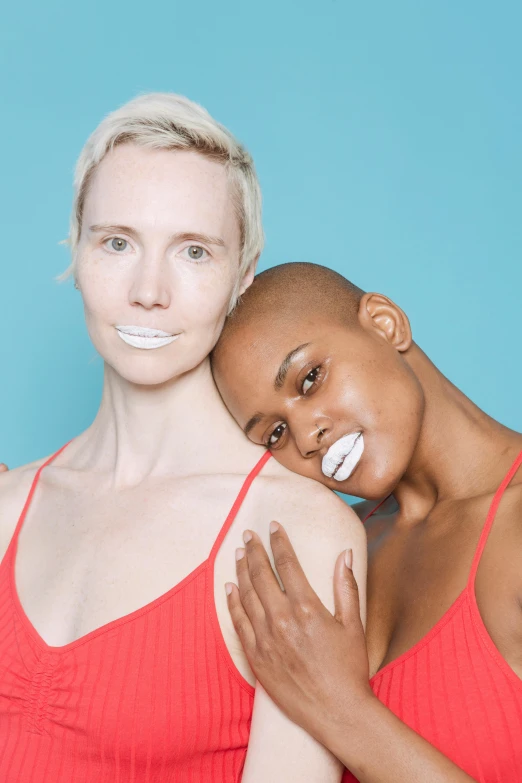 a couple of women standing next to each other, inspired by Vanessa Beecroft, trending on unsplash, short white hair shaved sides, ru paul\'s drag race, lipstick, wearing white leotard