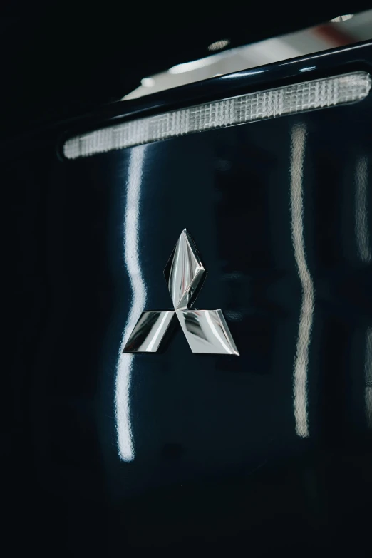 a close up of a logo on a car, a picture, unsplash, hypermodernism, akira yasuda, triforce, low quality photo, made of steel