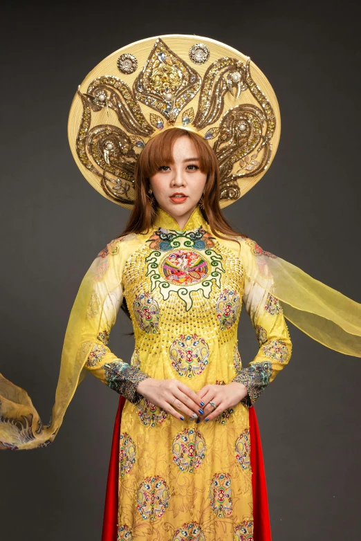 a woman in a yellow dress and a yellow hat, an album cover, inspired by Jin Nong, cloisonnism, ornate cosplay, vietnam, photo”, square