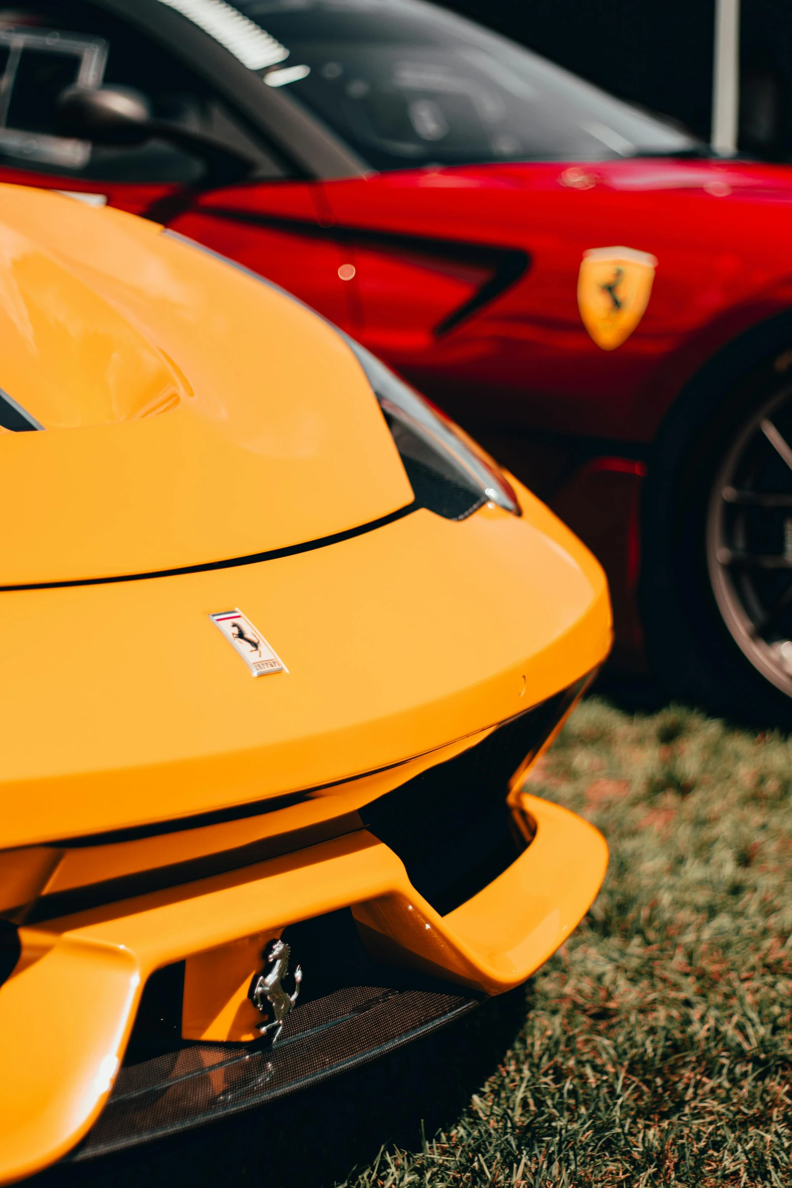 a red and a yellow sports car parked next to each other, pexels contest winner, renaissance, neck zoomed in, festivals, f12, yellow