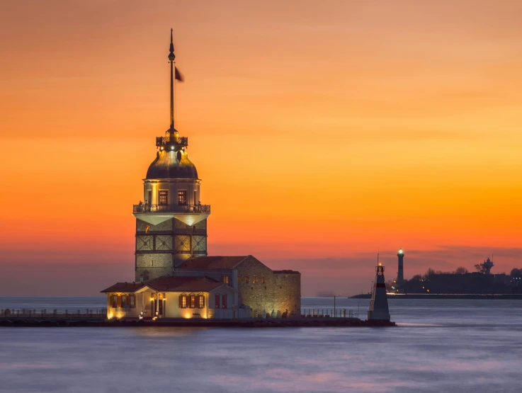 a lighthouse in the middle of a body of water, by Niyazi Selimoglu, pexels contest winner, renaissance, ottoman sultan, orange dawn, neoclassical tower with dome, professionally post-processed