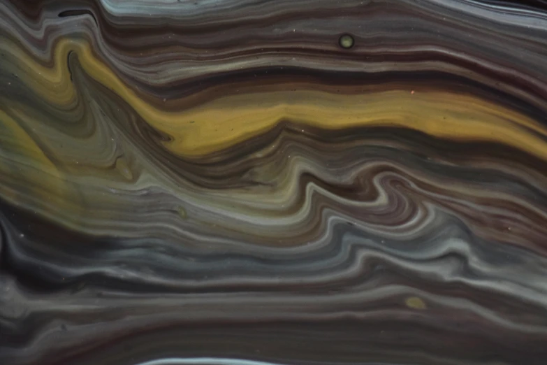 a close up of a liquid substance on a surface, inspired by John Martin, pexels, analytical art, brown, grey, jupiter, opaque glass
