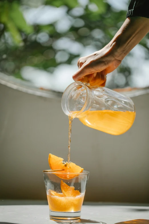 a person pouring orange juice into a glass, by Lee Loughridge, al fresco, straining, infused, crisp details