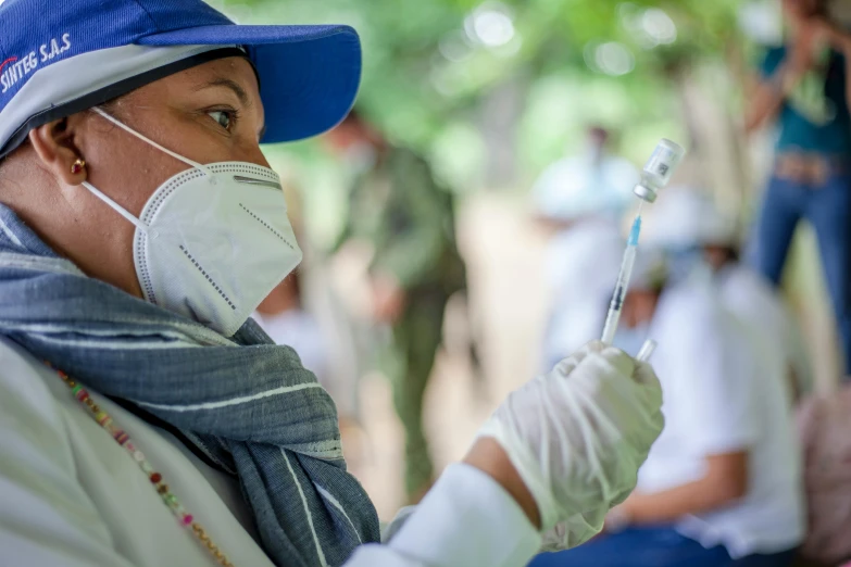 a close up of a person wearing a mask and gloves, holding a syringe, cambodia, avatar image, content