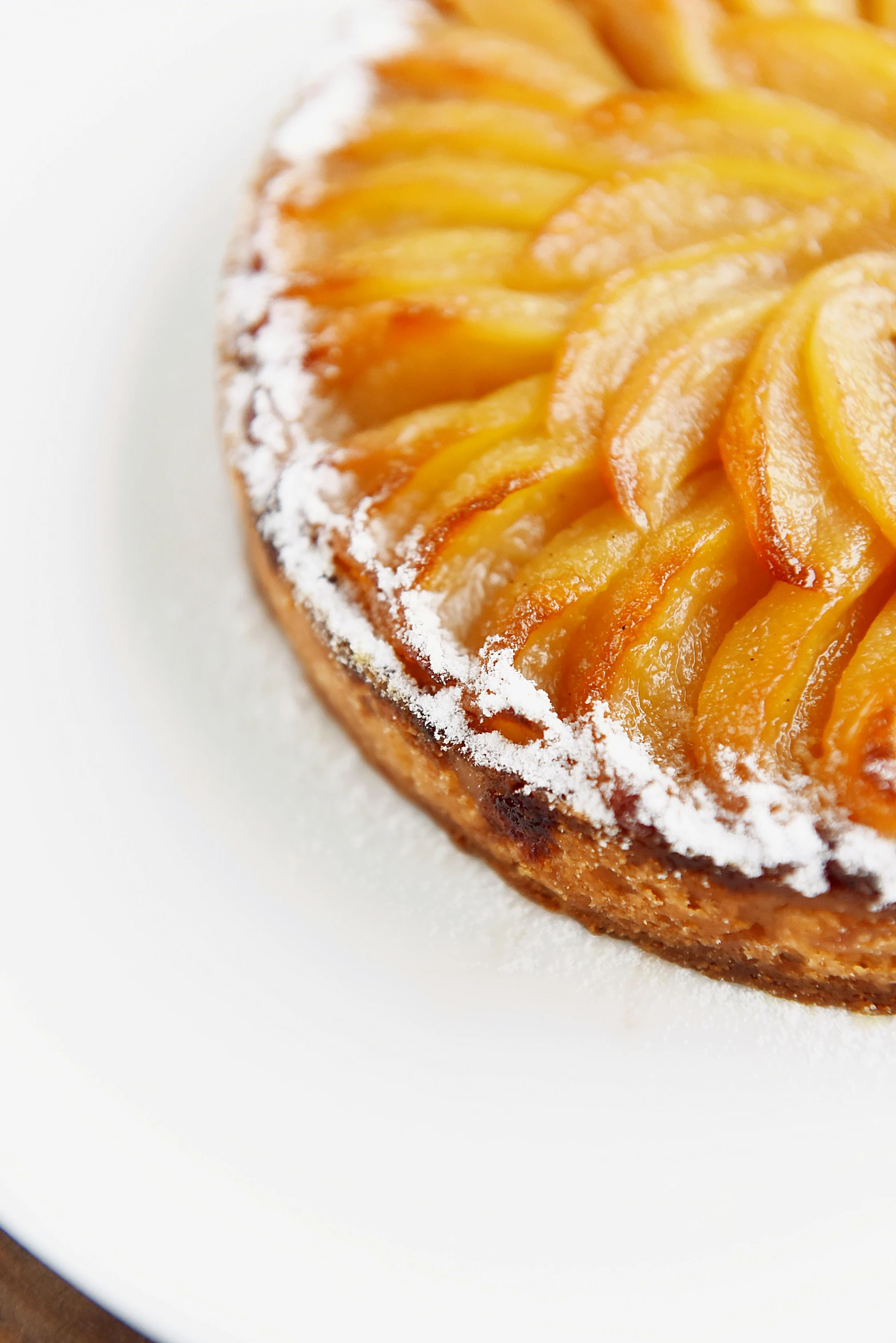 a close up of a cake on a plate, peach, detailed product shot, round-cropped, crisp detail