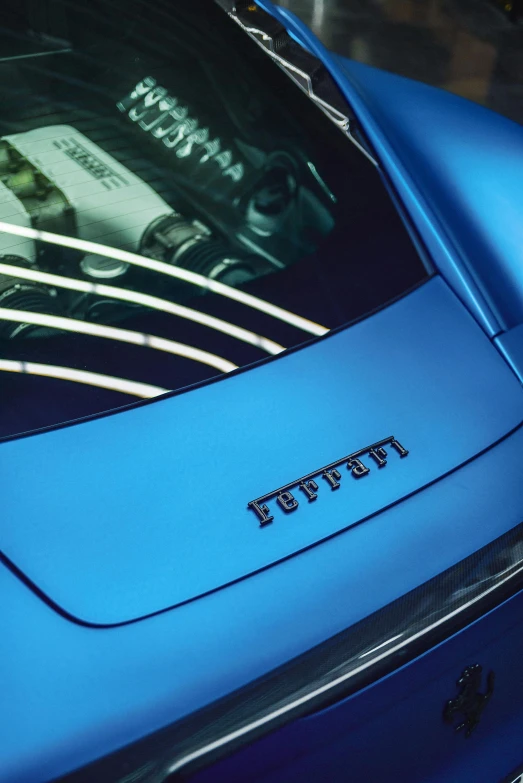 a blue sports car parked in a parking lot, inspired by Francesco Furini, unsplash, purism, chest plate with ferrari logo, closeup - view, paul barson, neon blue