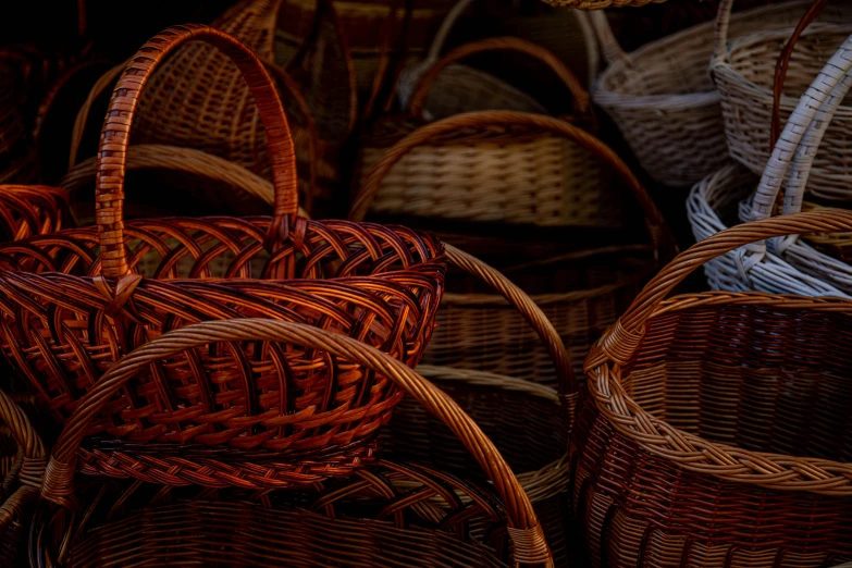 a bunch of wicker baskets sitting next to each other, a picture, by Adam Marczyński, pexels, brown red blue, thumbnail, dark and white, shops