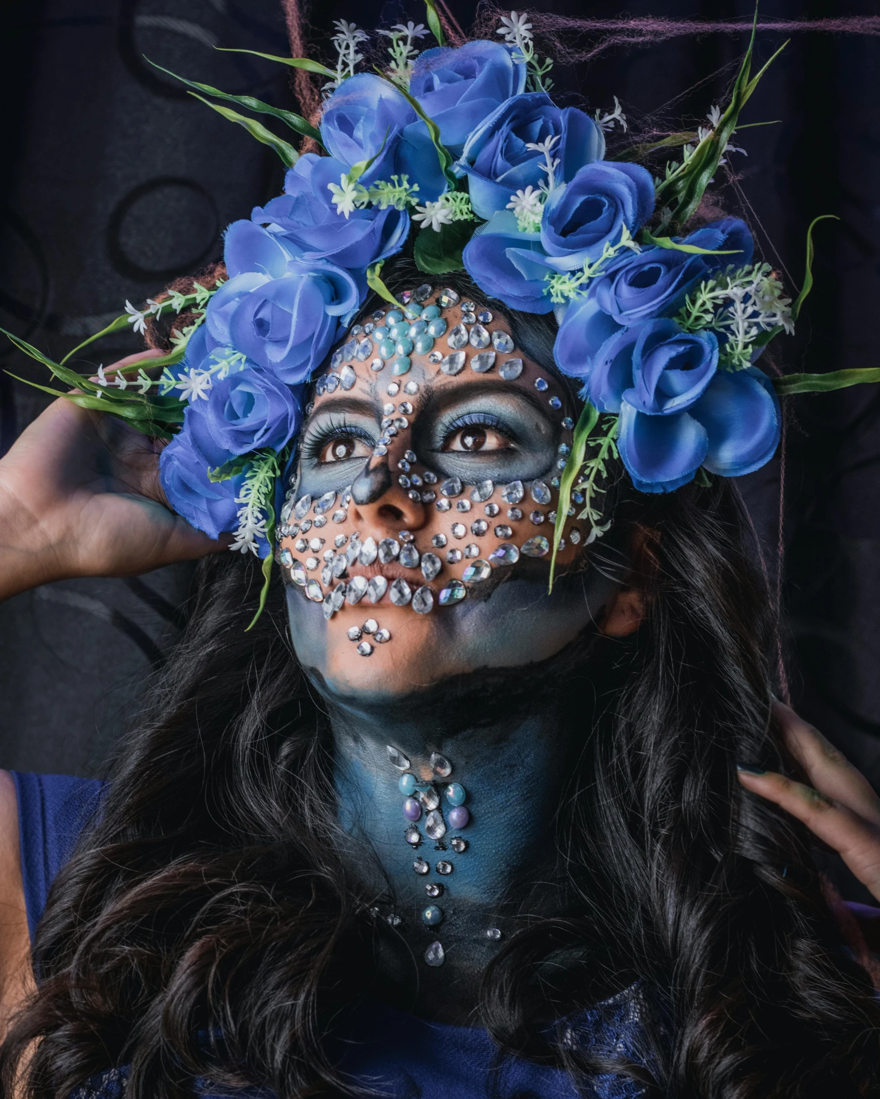 a woman with blue makeup and flowers on her head, by Briana Mora, pexels contest winner, jeweled costume, anatomically perfect, raziel irl, lgbtq